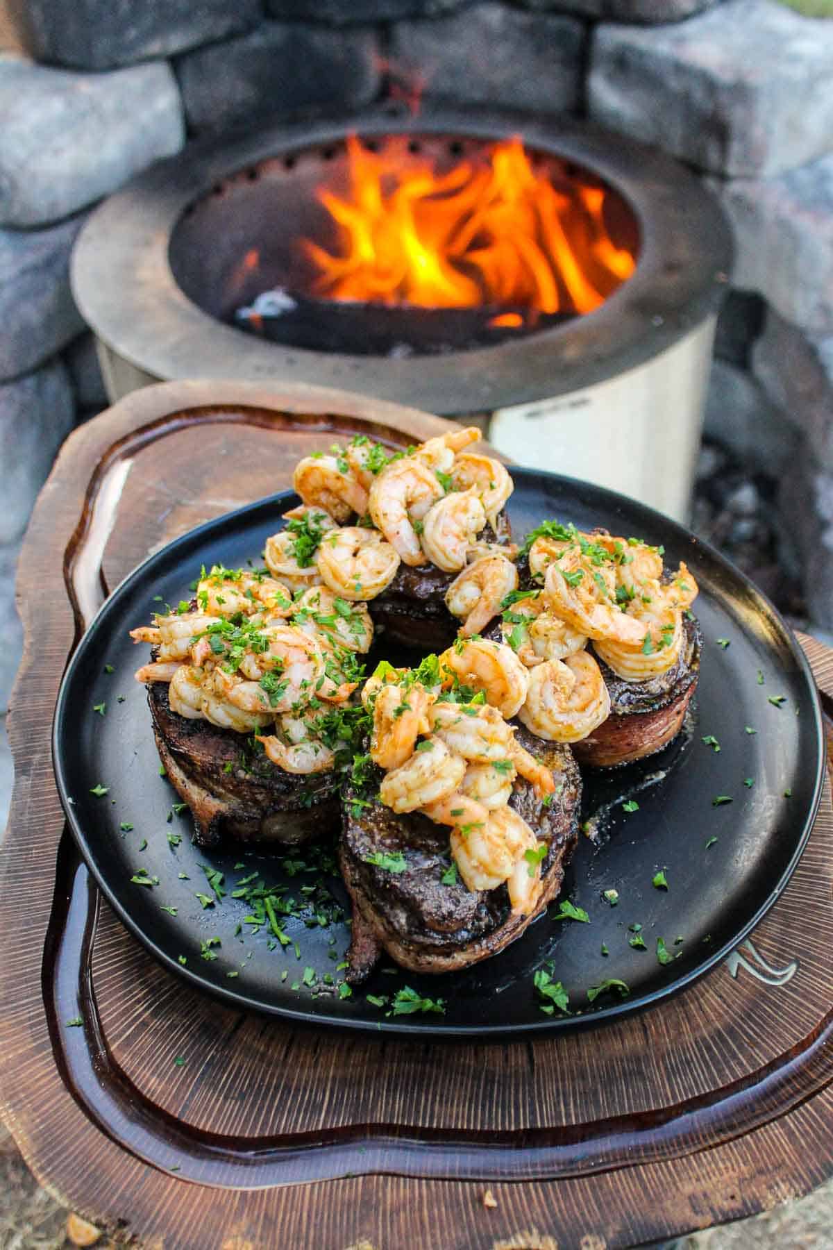 Bacon Wrapped Filet Mignon with Garlic Shrimp plated and ready to serve.