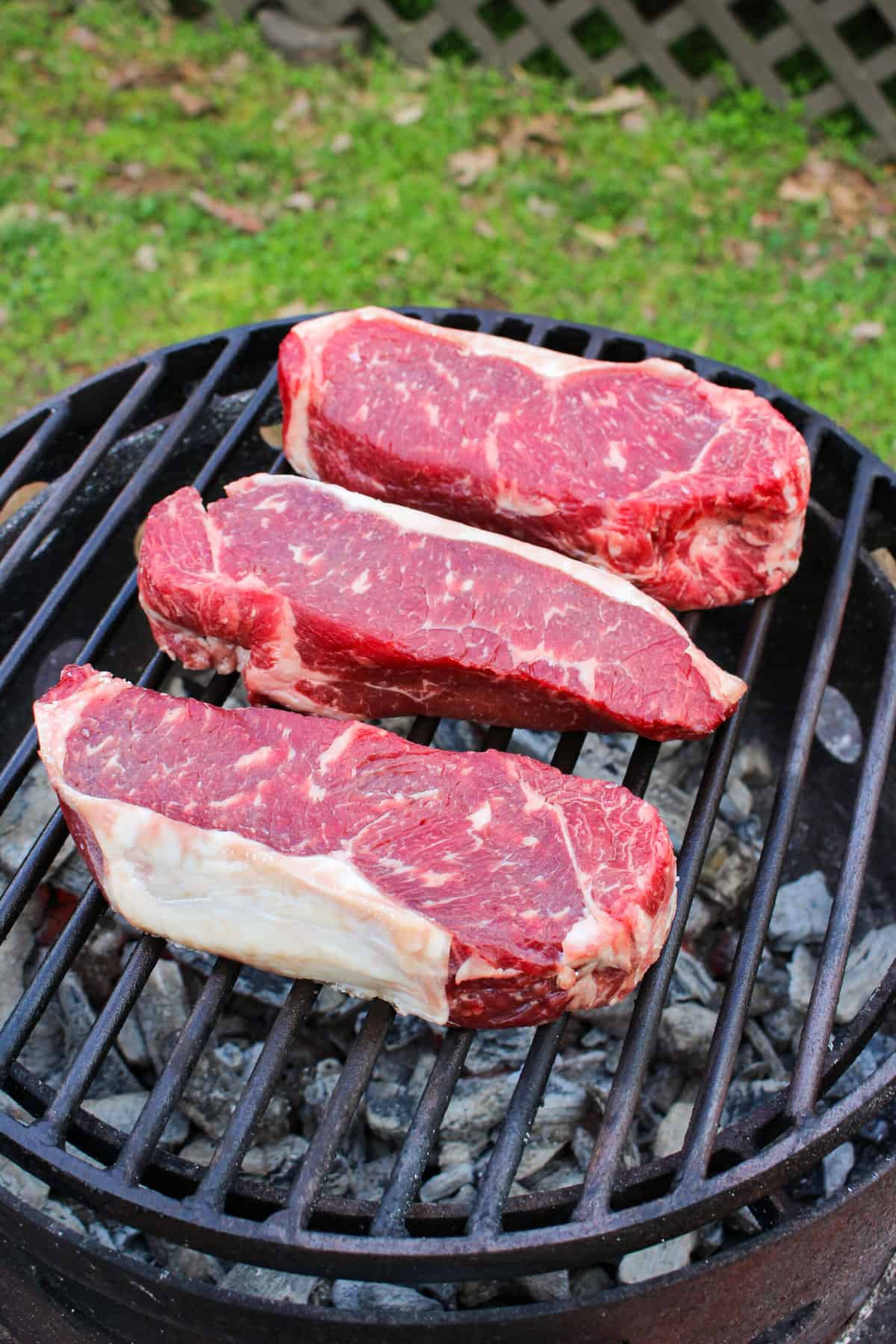 Dry Brined NY Strip Steaks on the grill