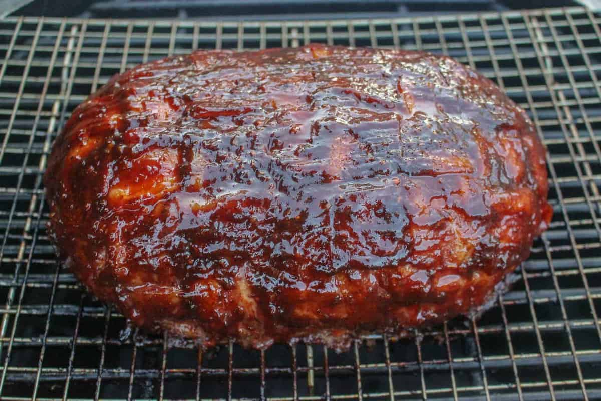 The cooked Cheese Stuffed Smoked Meatloaf covered in BBQ sauce. 