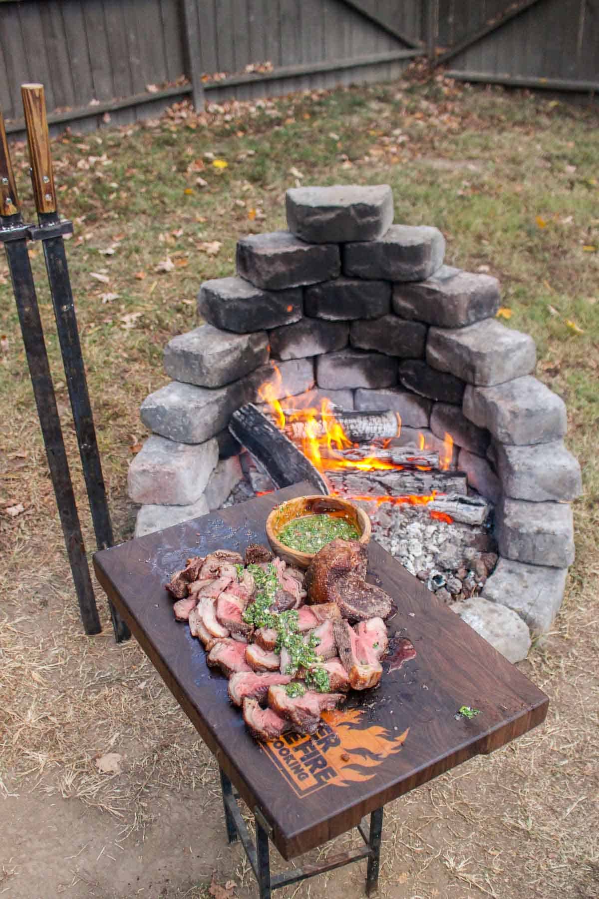 The finished dish with the swords and fire in the background.