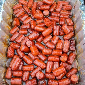 The smoked hot dog burnt ends ready to be pulled from the smoker.