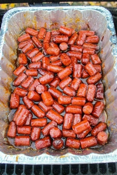 The smoked hot dog burnt ends ready to be pulled from the smoker.