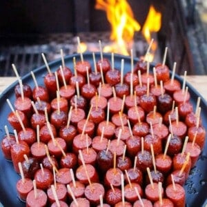 Smoked Hot Dog Burnt Ends plated with toothpicks for easy serving.