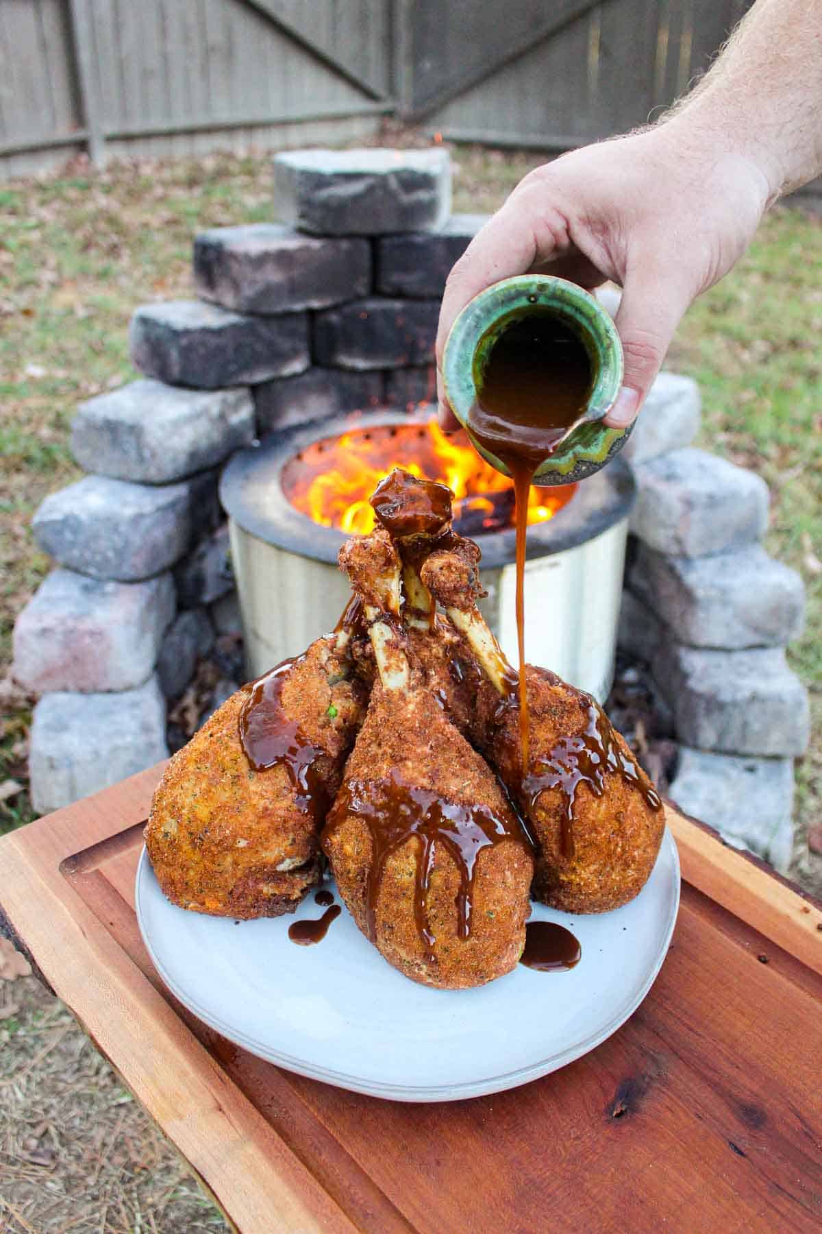 Drizzling gravy over the Thanksgiving Turkey Leg Poppers.