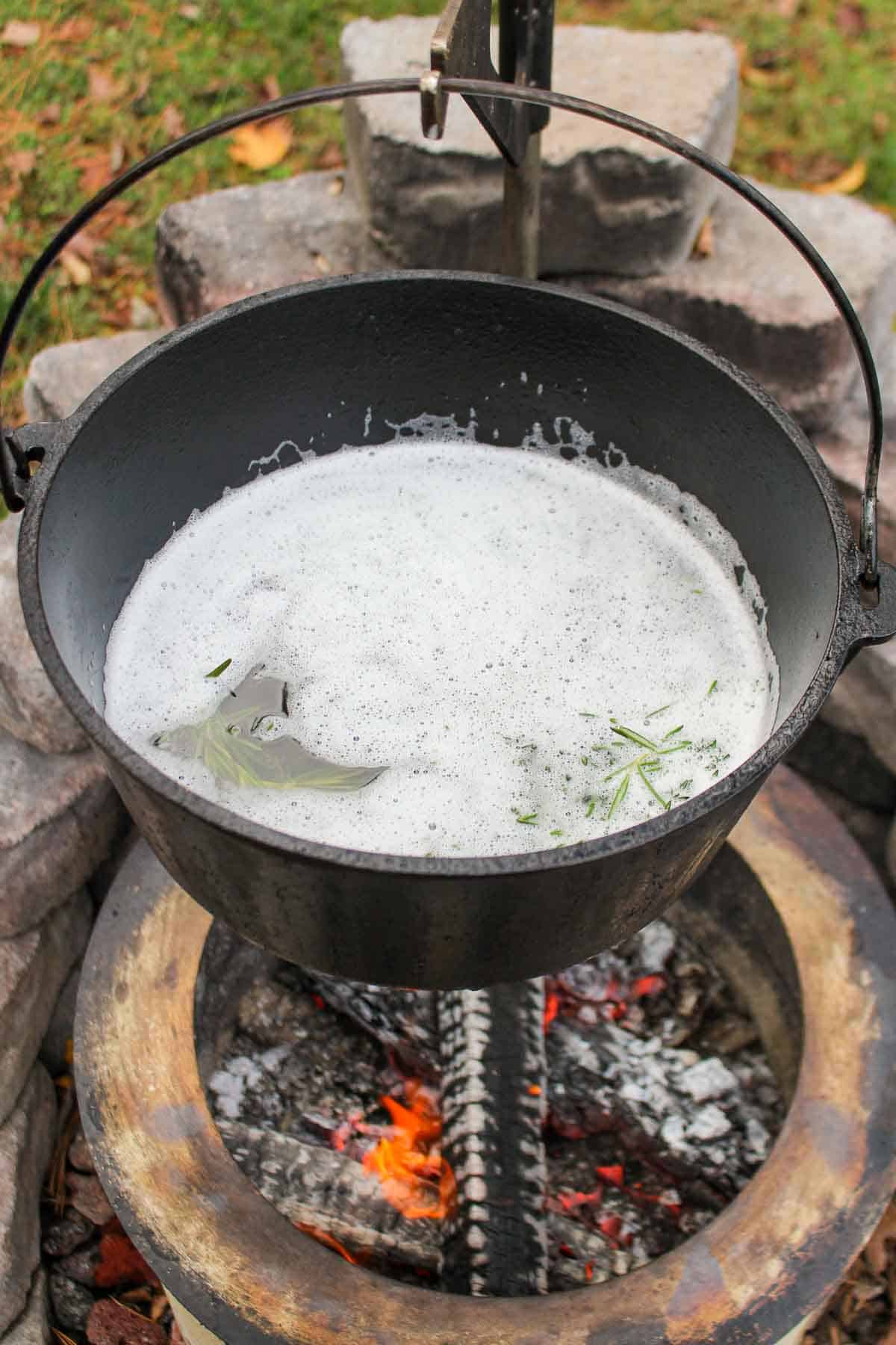 The beef tallow melting in the dutch oven.