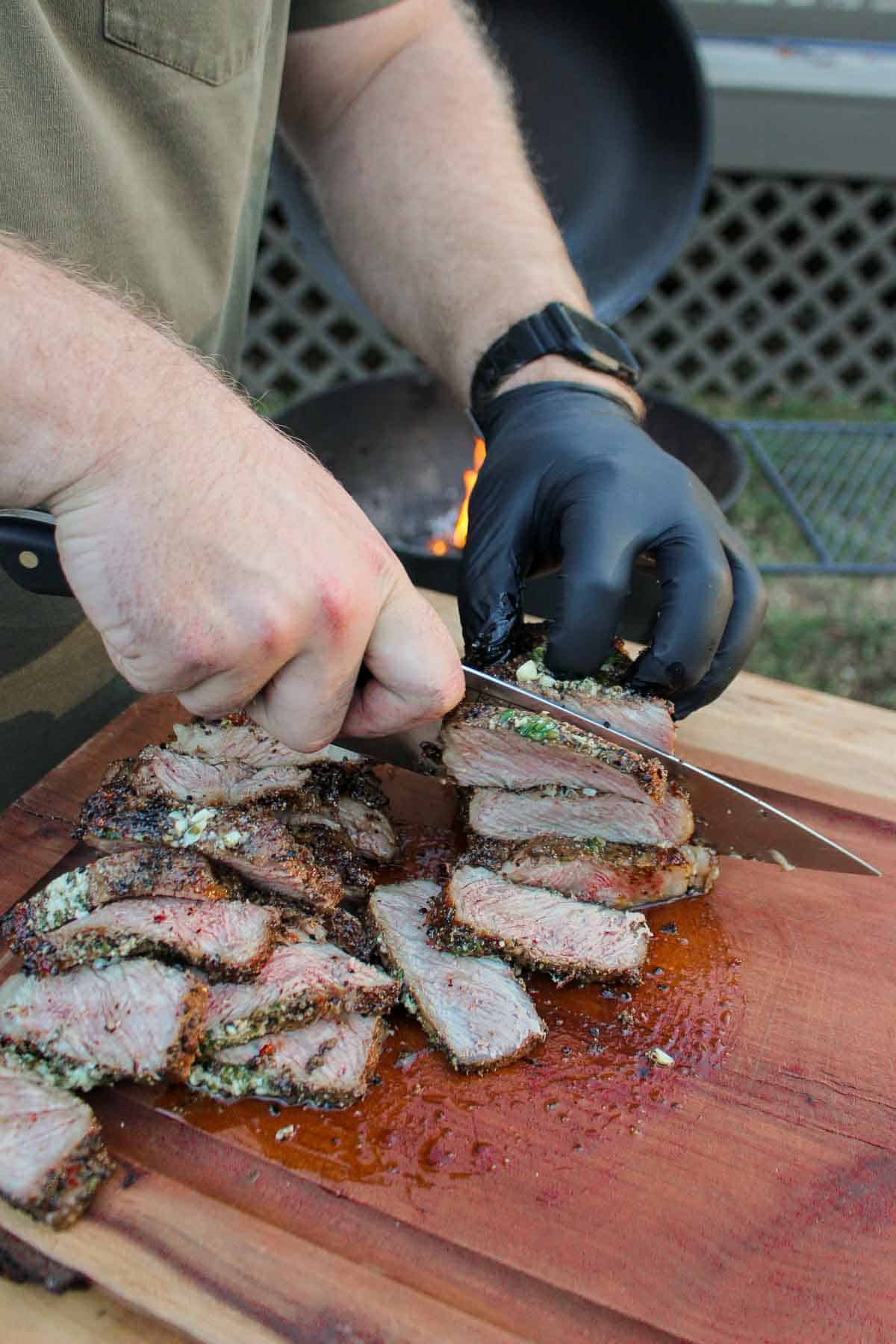 Slicing up the grilled steaks.