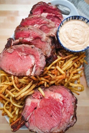 Smoked Fried Prime Rib on a serving platter with fries.