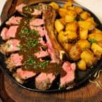 Pan Seared Steak with Crispy Potatoes plated and ready to serve.
