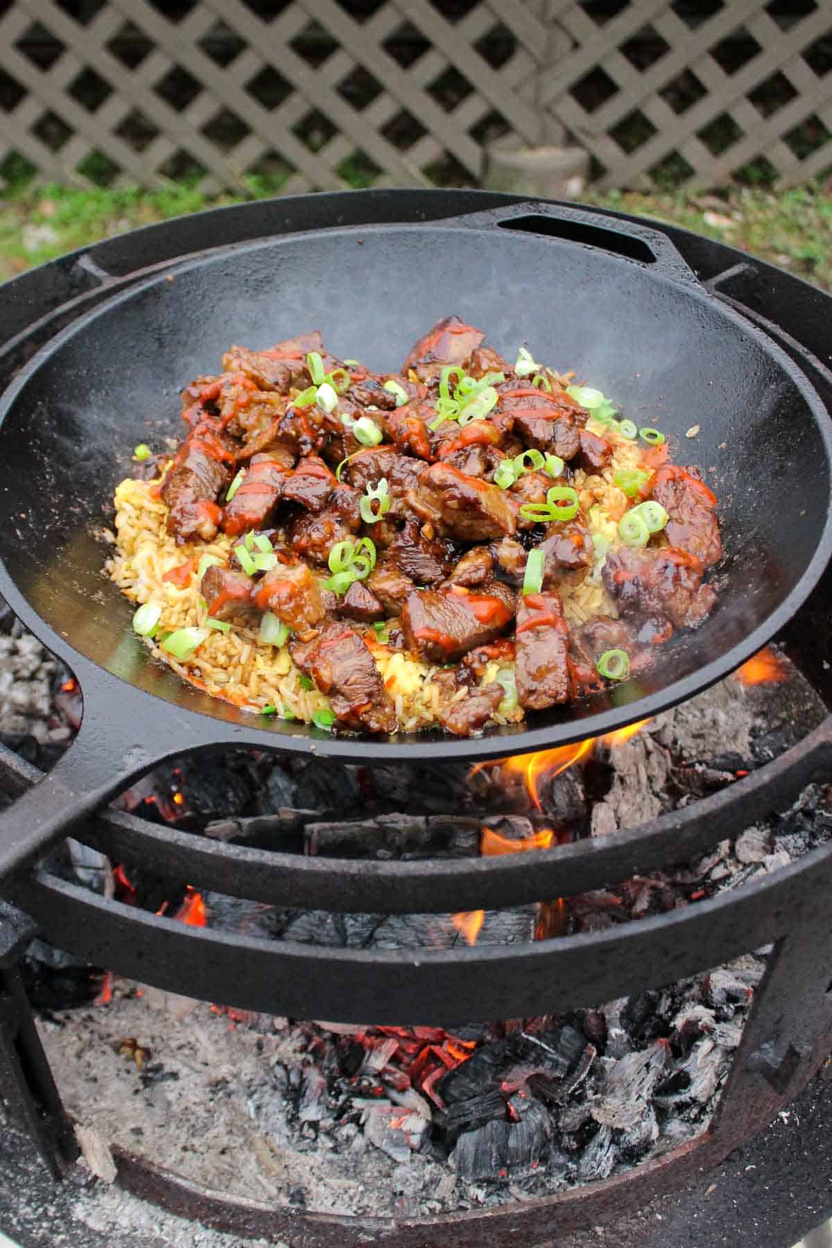 Garlic Teriyaki Steak Bites sizzling on the grill.