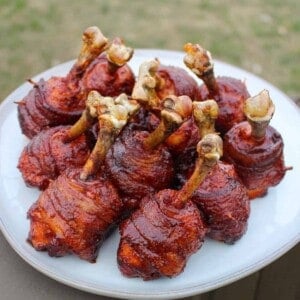 Honey Bacon BBQ Chicken Lollipops all together on a serving platter.