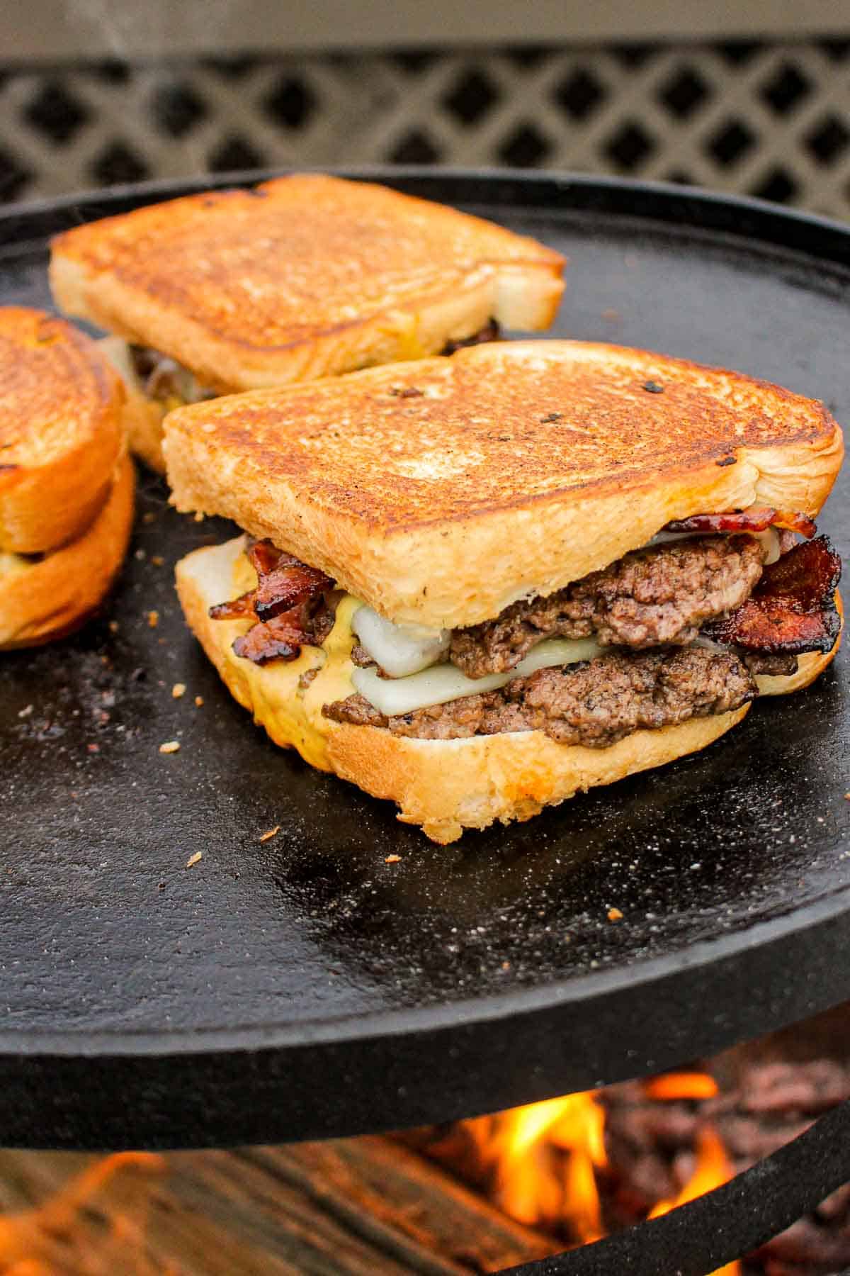 The Oklahoma Onion Patty Melts toasting on the plancha.