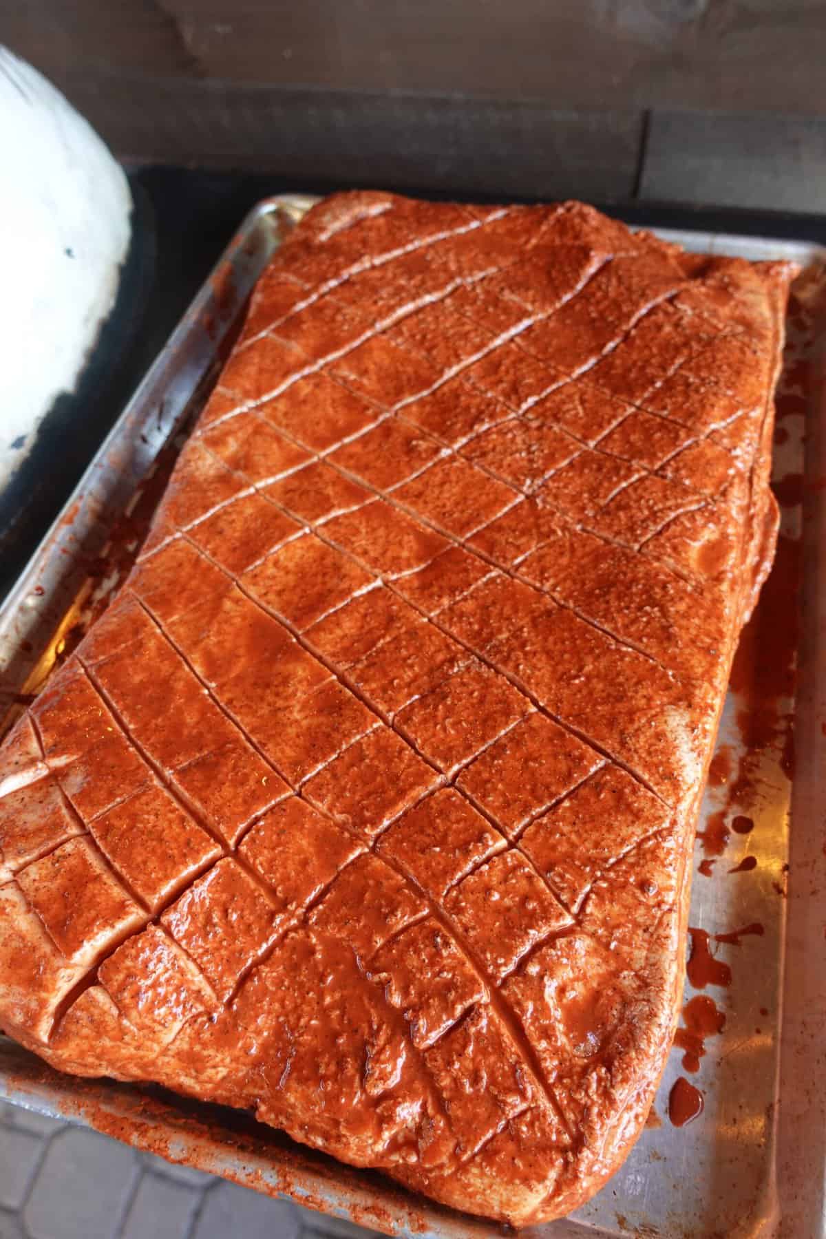 The whole, seasoned pork belly.