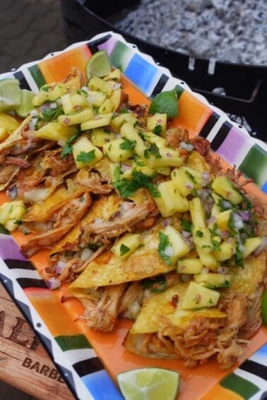 Al Pastor Pork Belly Tacos served on a platter.