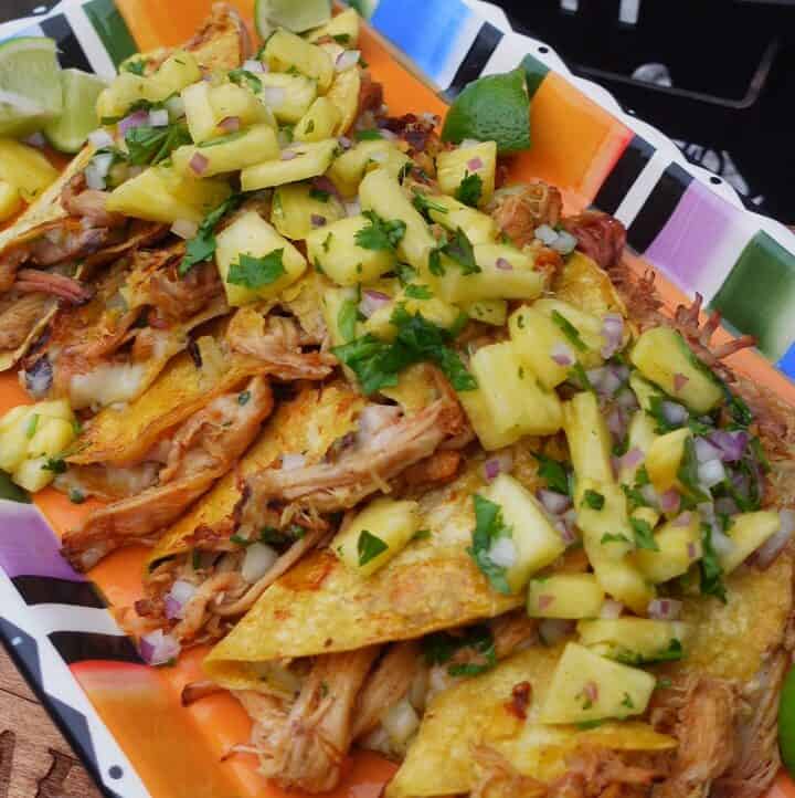 Al Pastor Pork Belly Tacos served on a platter.