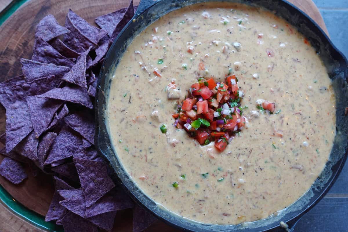 An overhead shot of the finalized smoked brisket queso.