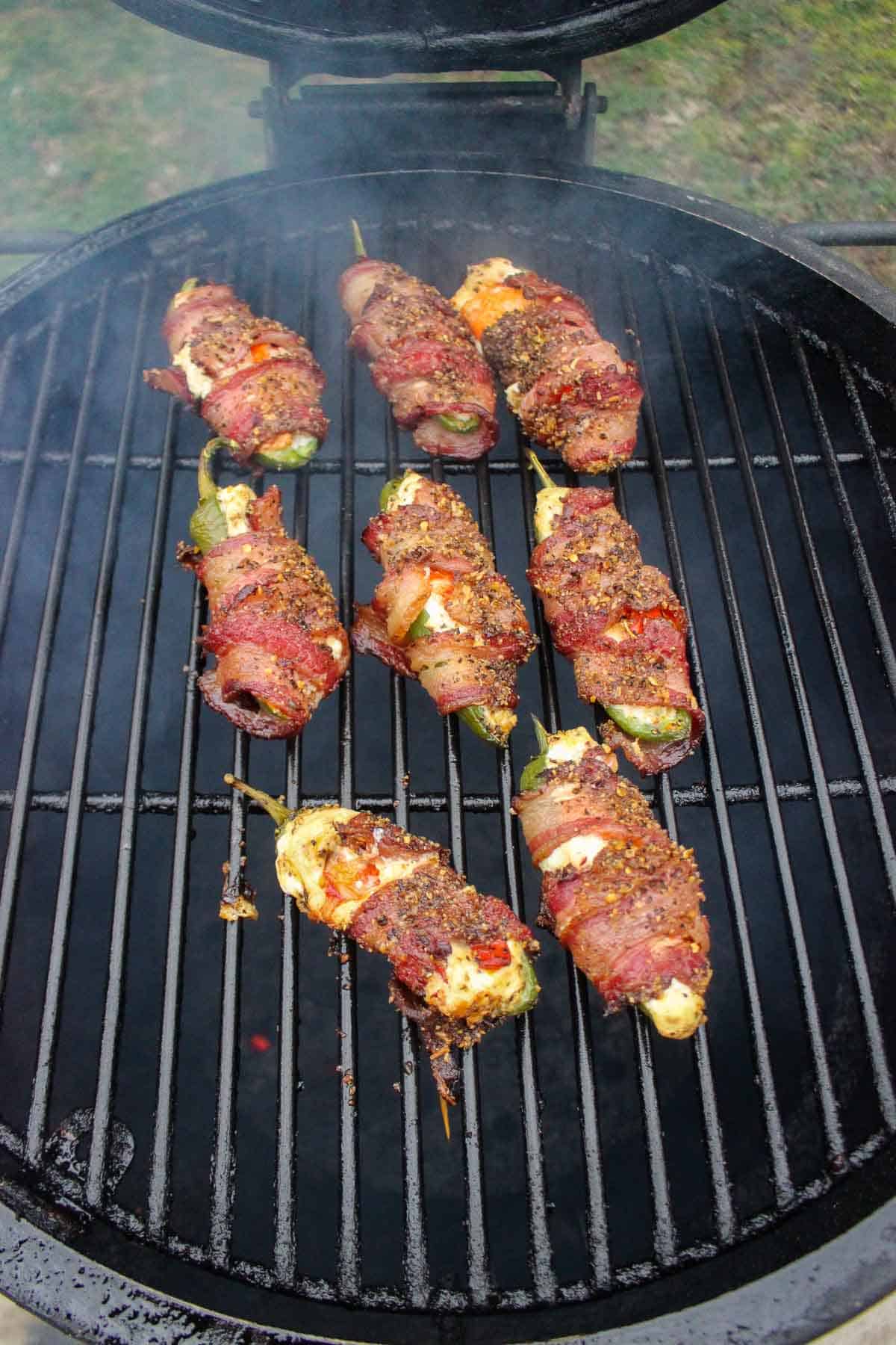 The jalapeño poppers almost finished cooking on the smoker.