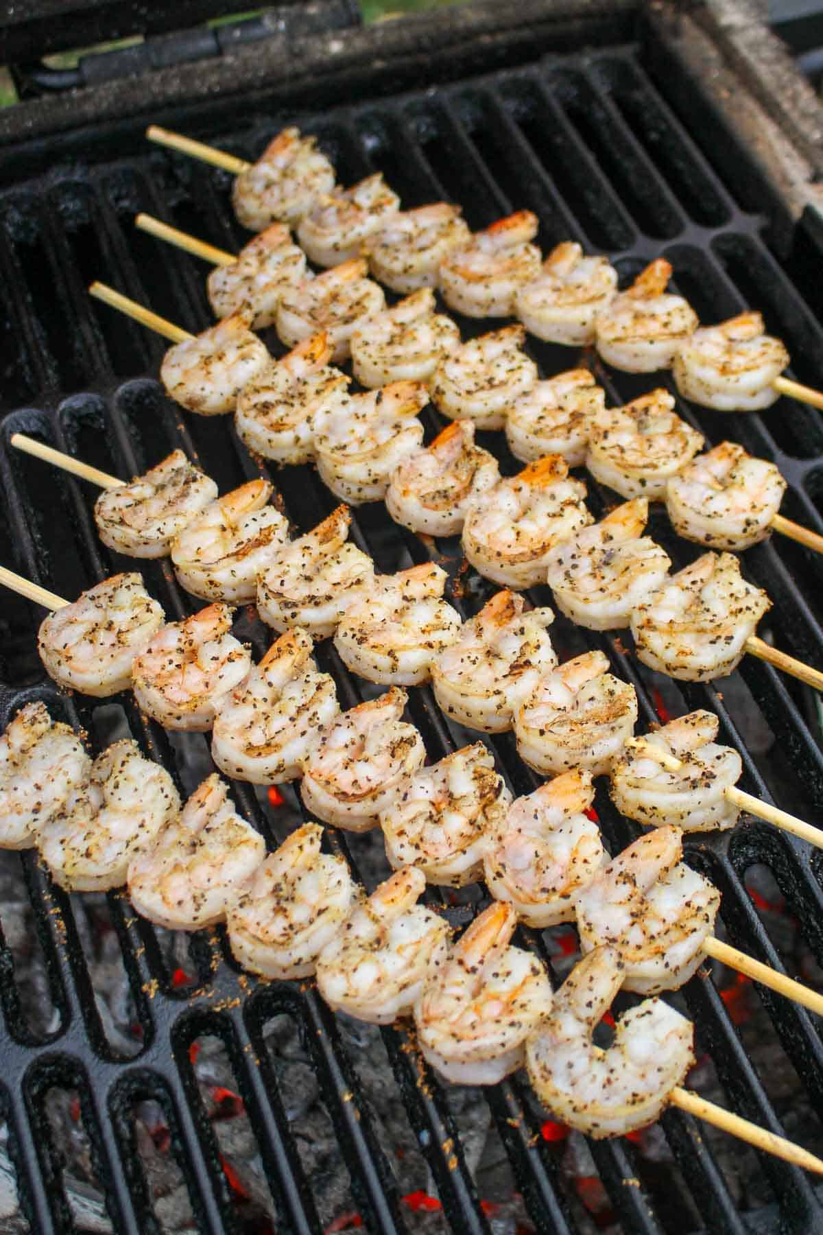 The shrimp grilling over the fire.