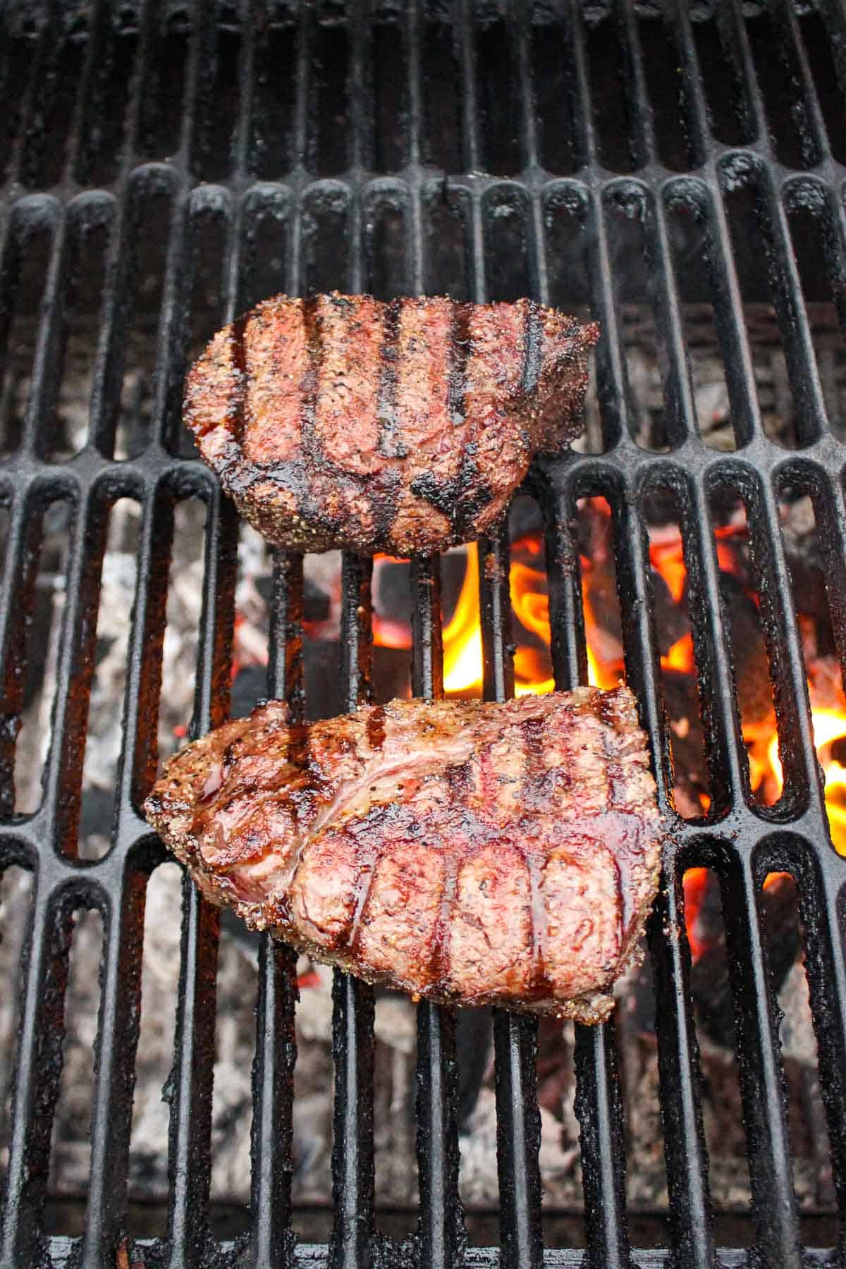 The grilled steaks after being flipped.