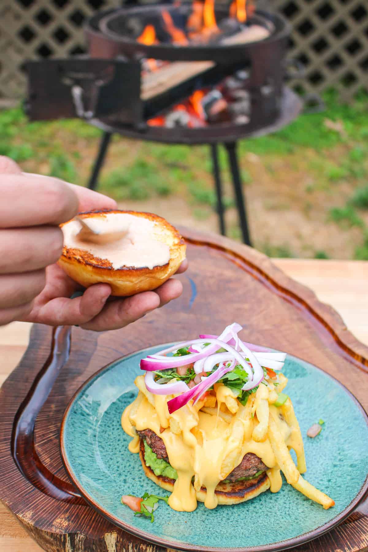 Adding the chipotle lime mayo to the top bun.