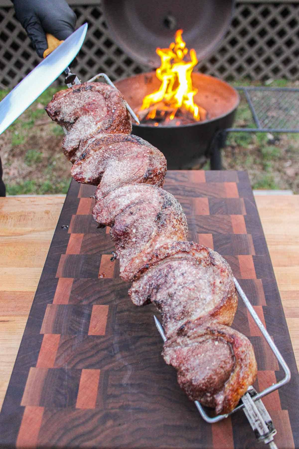 Rotisserie Picanha about to get sliced into.