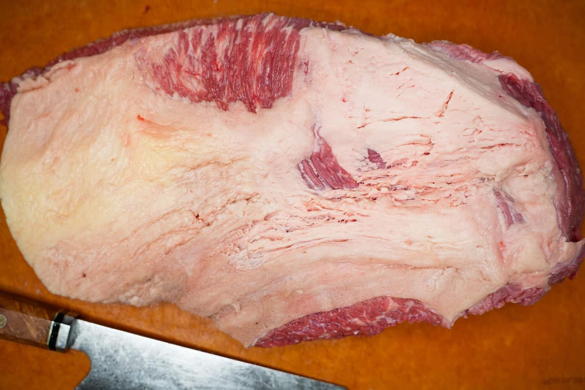 The raw, trimmed beef brisket.