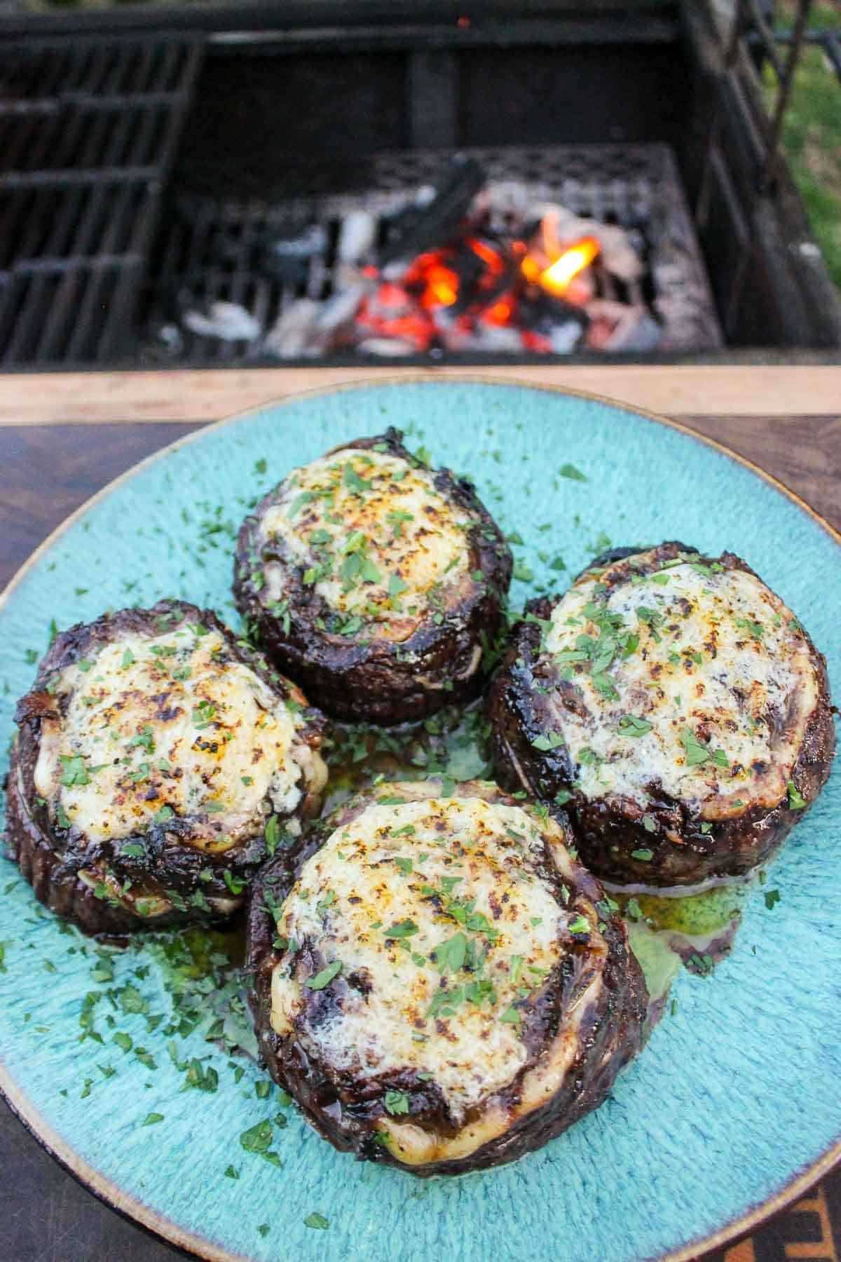 An overhead shot of the melted cheese crust so you can see it melting down the sides of the French Onion Steak Pinwheels.