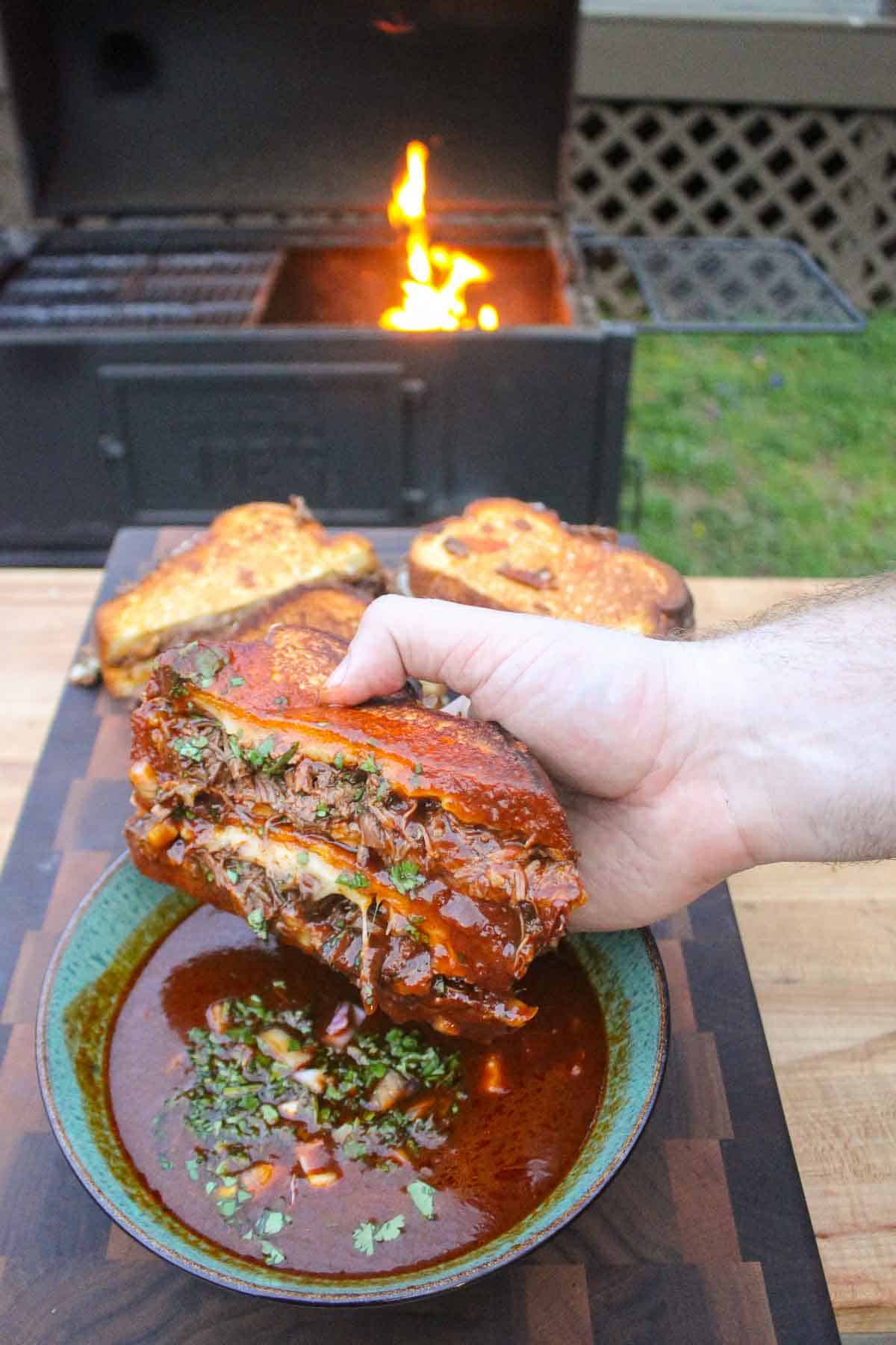 One final shot of the dipped Birria Grilled Cheese Sandwich so you can see the consomme dip.