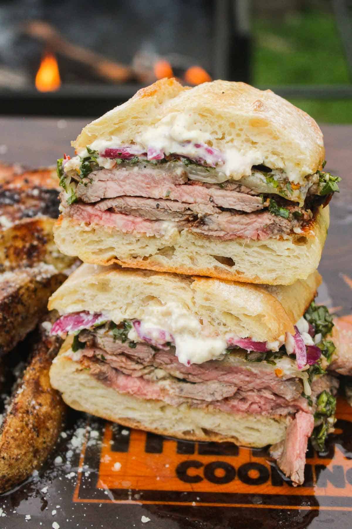 Chimichurri marinated tri-tip with grilled fries turned into a sandwich and ready to serve.