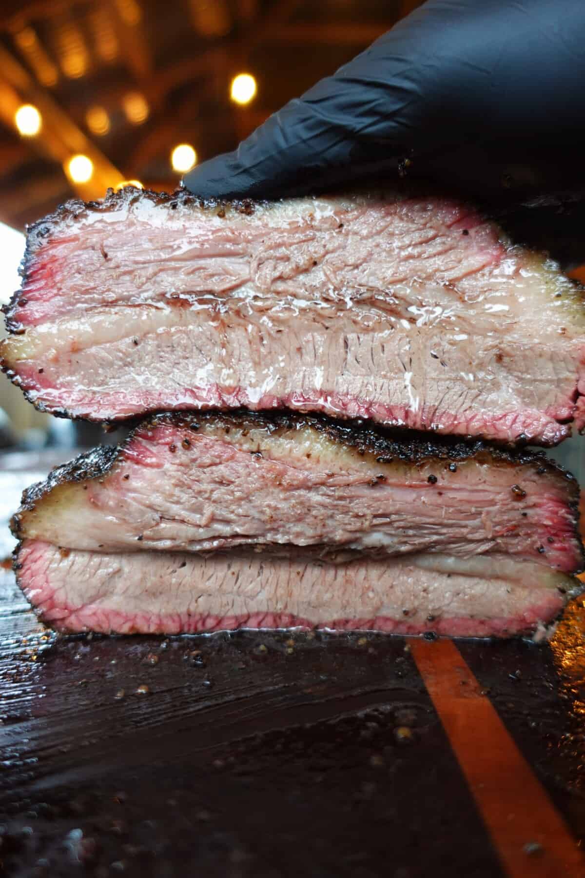 The sliced shot of a smoked brisket.