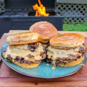 Peanut Butter and Jelly Smash Burgers plated so that they can be served.