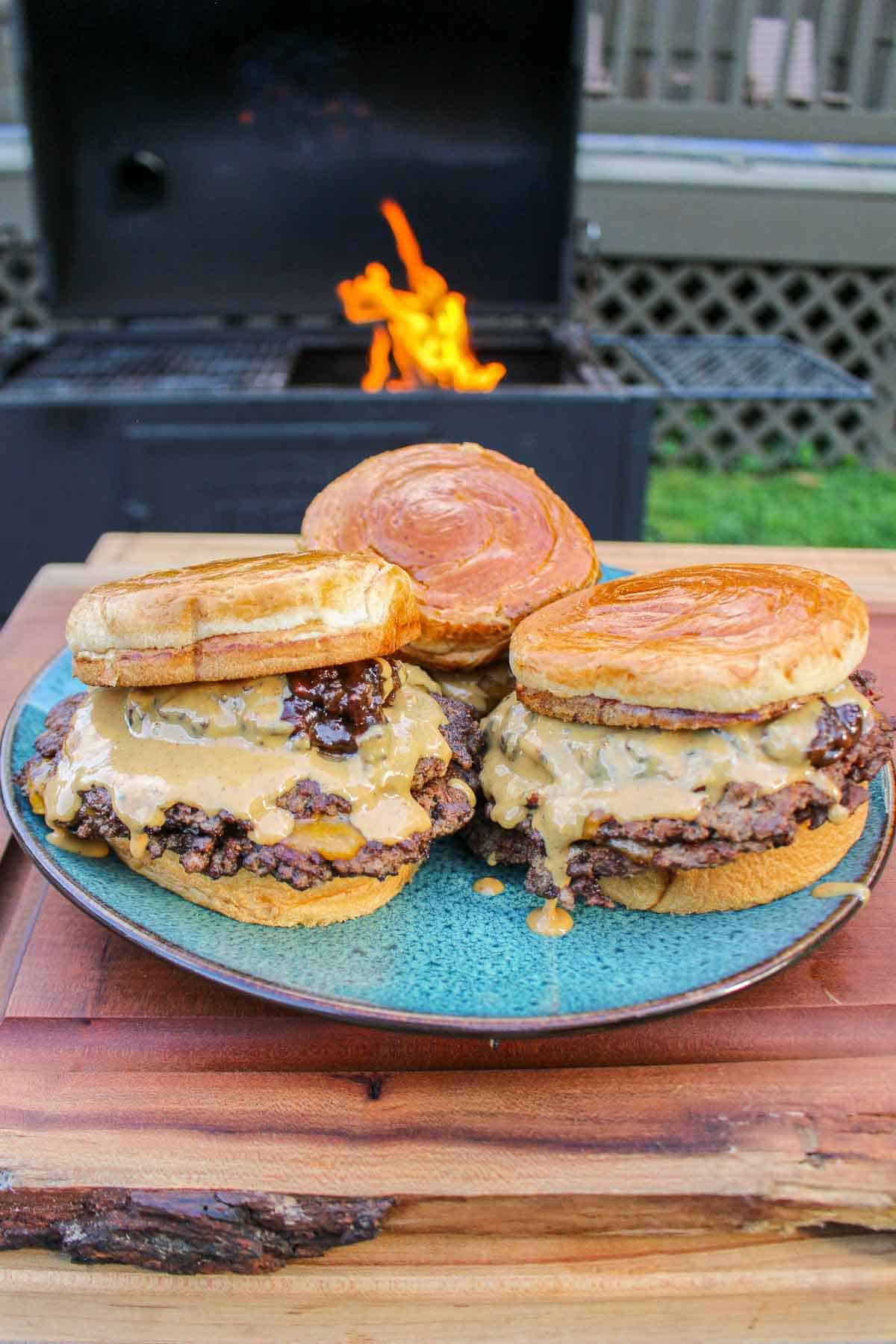 Peanut Butter and Jelly Smash Burgers plated so that they can be served.