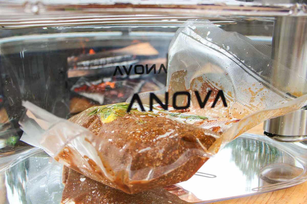 The meat cooking in the Anova sous vide.
