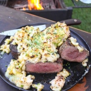 The grilled steak with lobster Mac and cheese assembled and served.