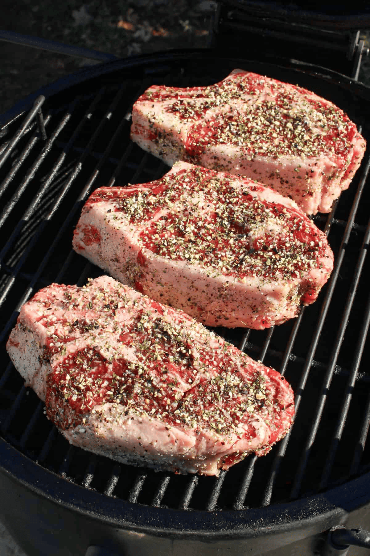 How to reverse sear a steak starts by indirectly cooking these ribeyes.