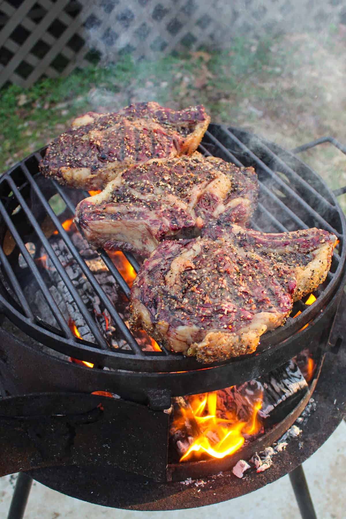 Reverse sear ribeye steaks getting set on the grill for the final sear.