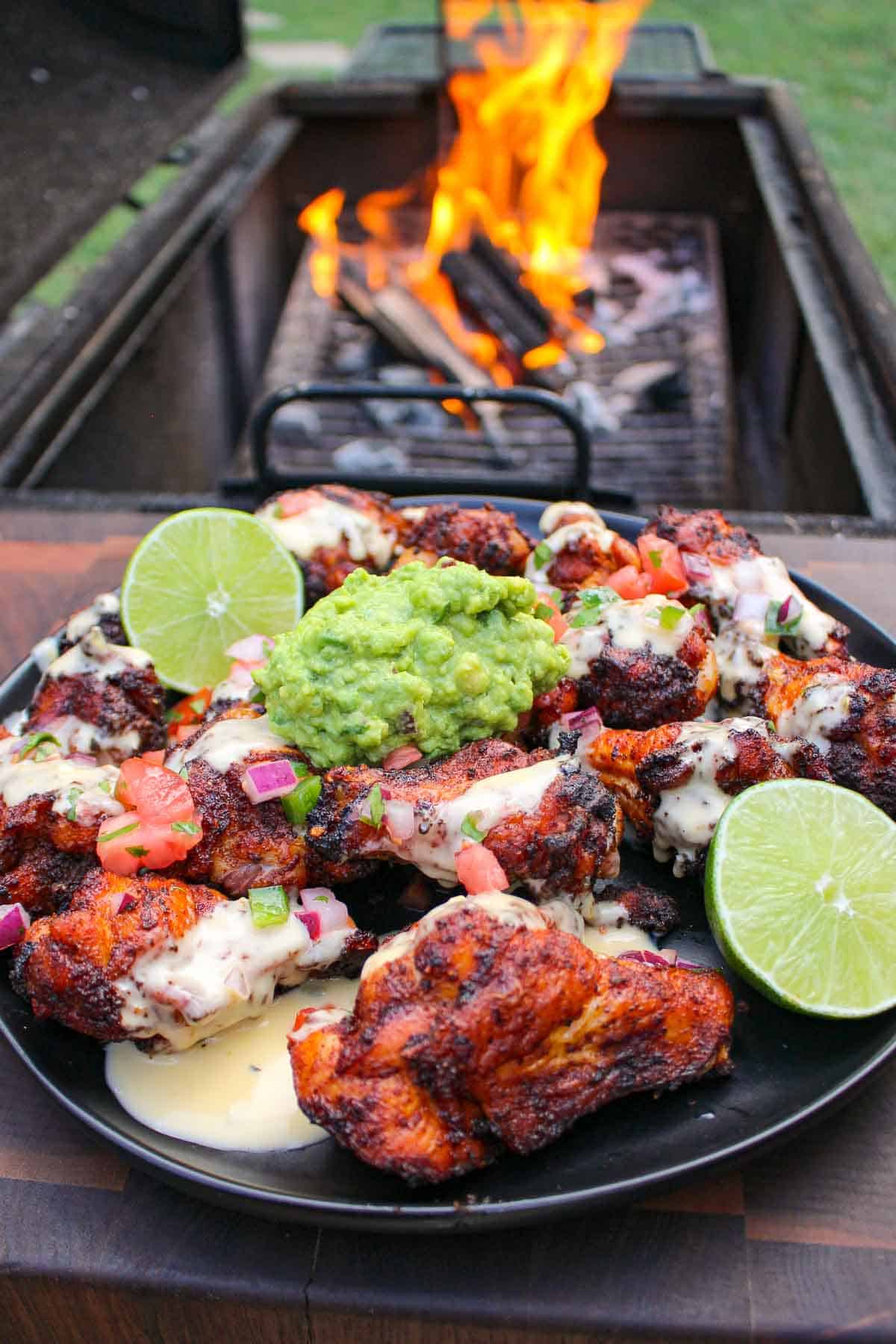 The Nacho Wings sitting on a serving plate.