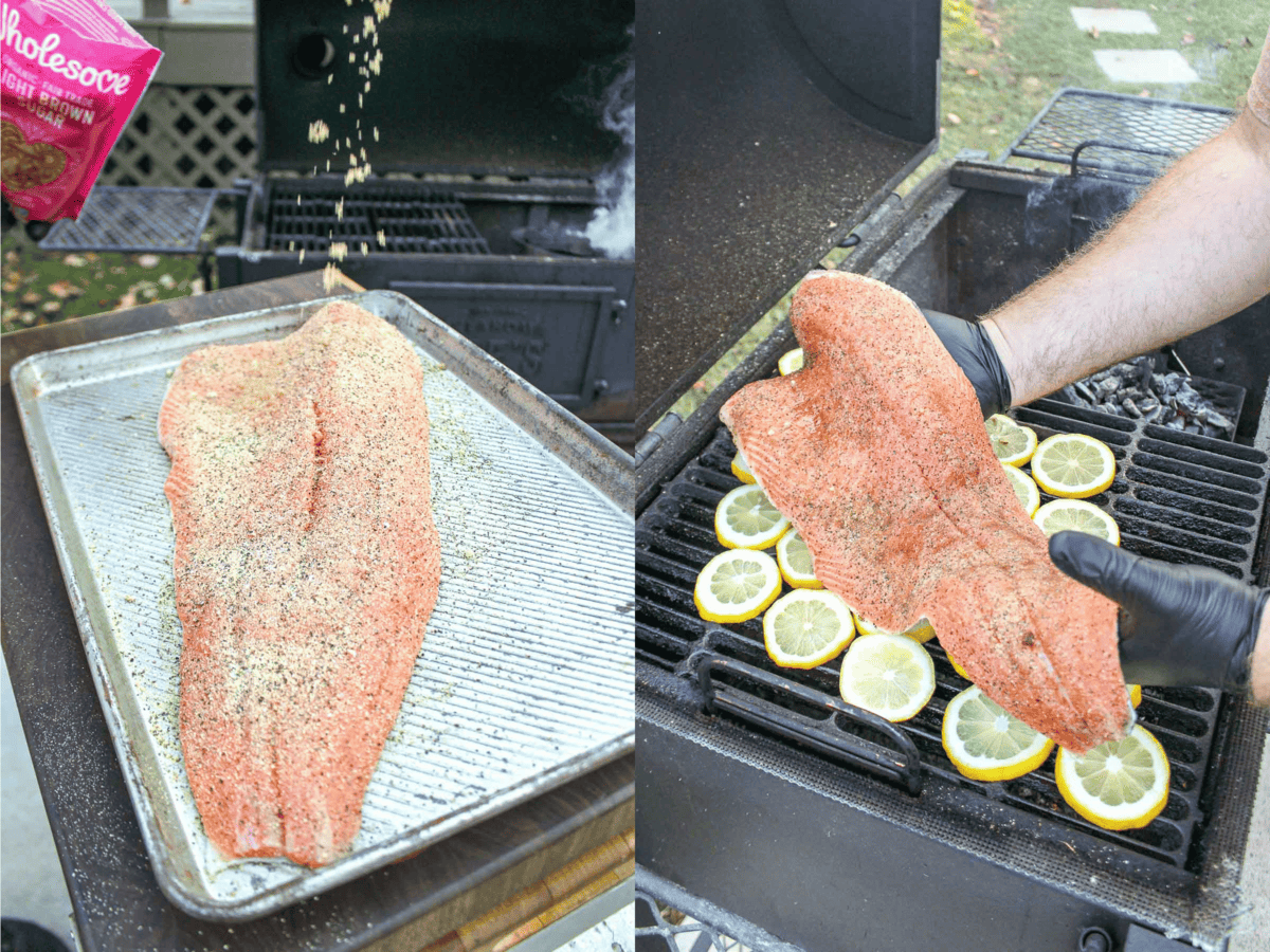 Seasoning the salmon before laying it over a plank of sliced lemons. 