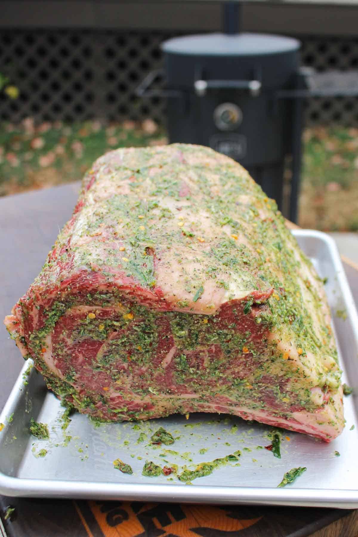 The herb mixture is slathered on the prime rib, fat side up. 