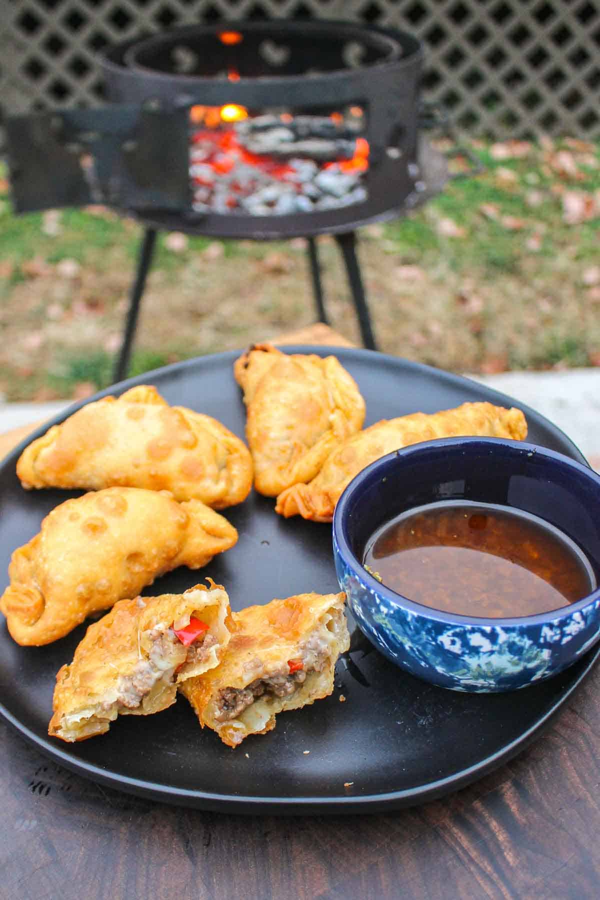 The crispy beef empanadas are served with chimichurri sauce. 