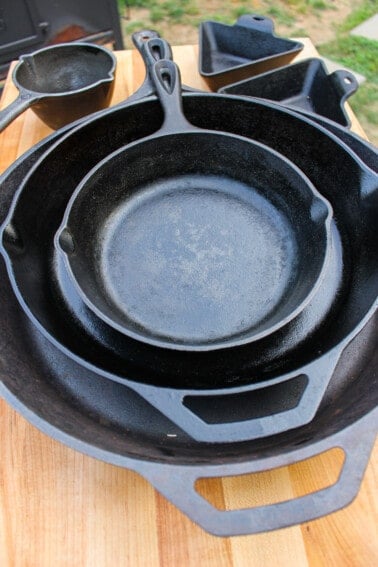 A shot of the various cast iron pans and skillets we use for cooking.