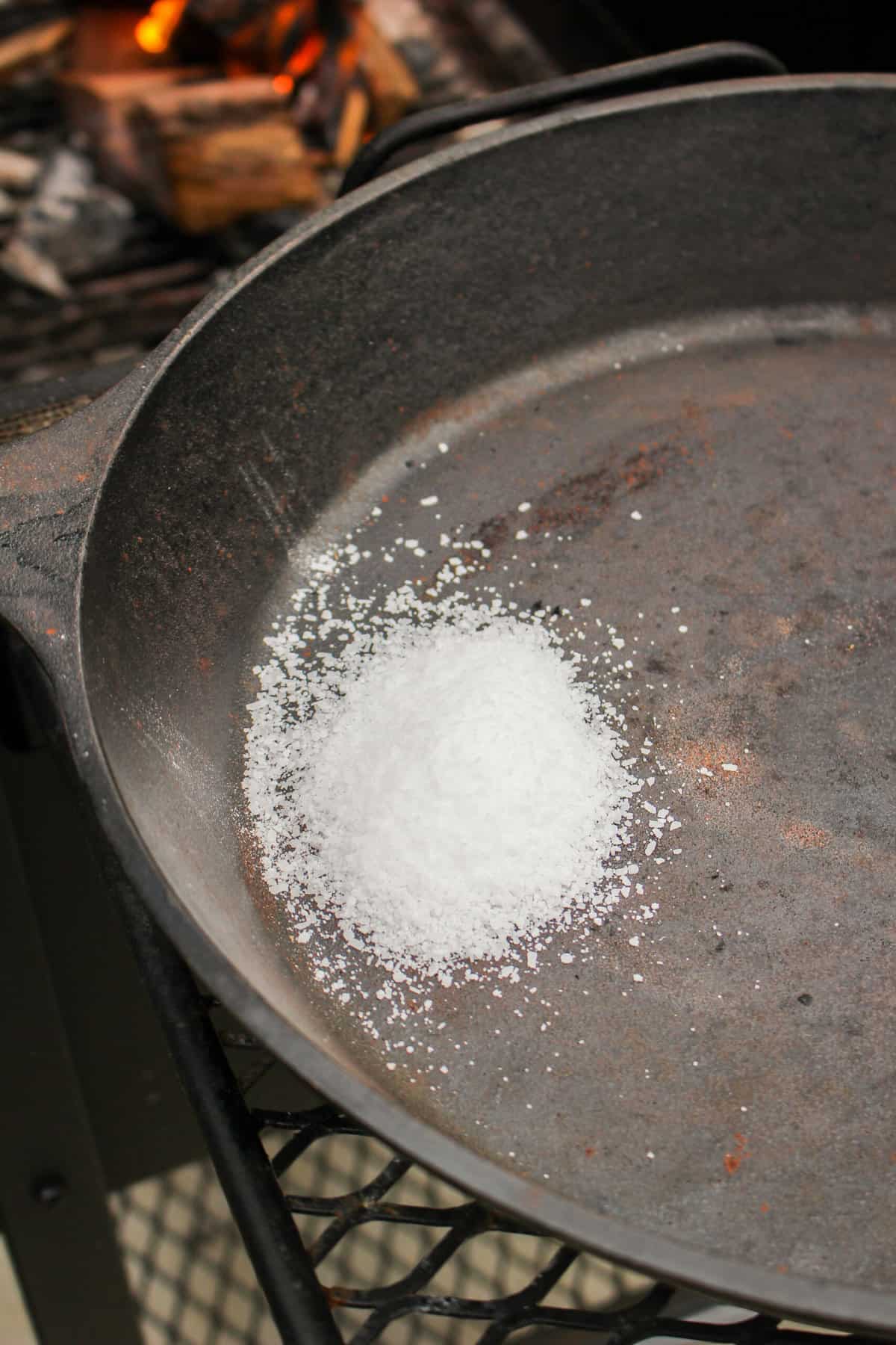 Couse salt poured in a pan so that we can clean it.