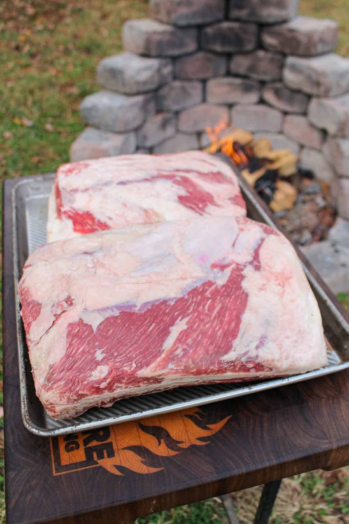 Plate ribs are prepared for the rotisserie fire. 