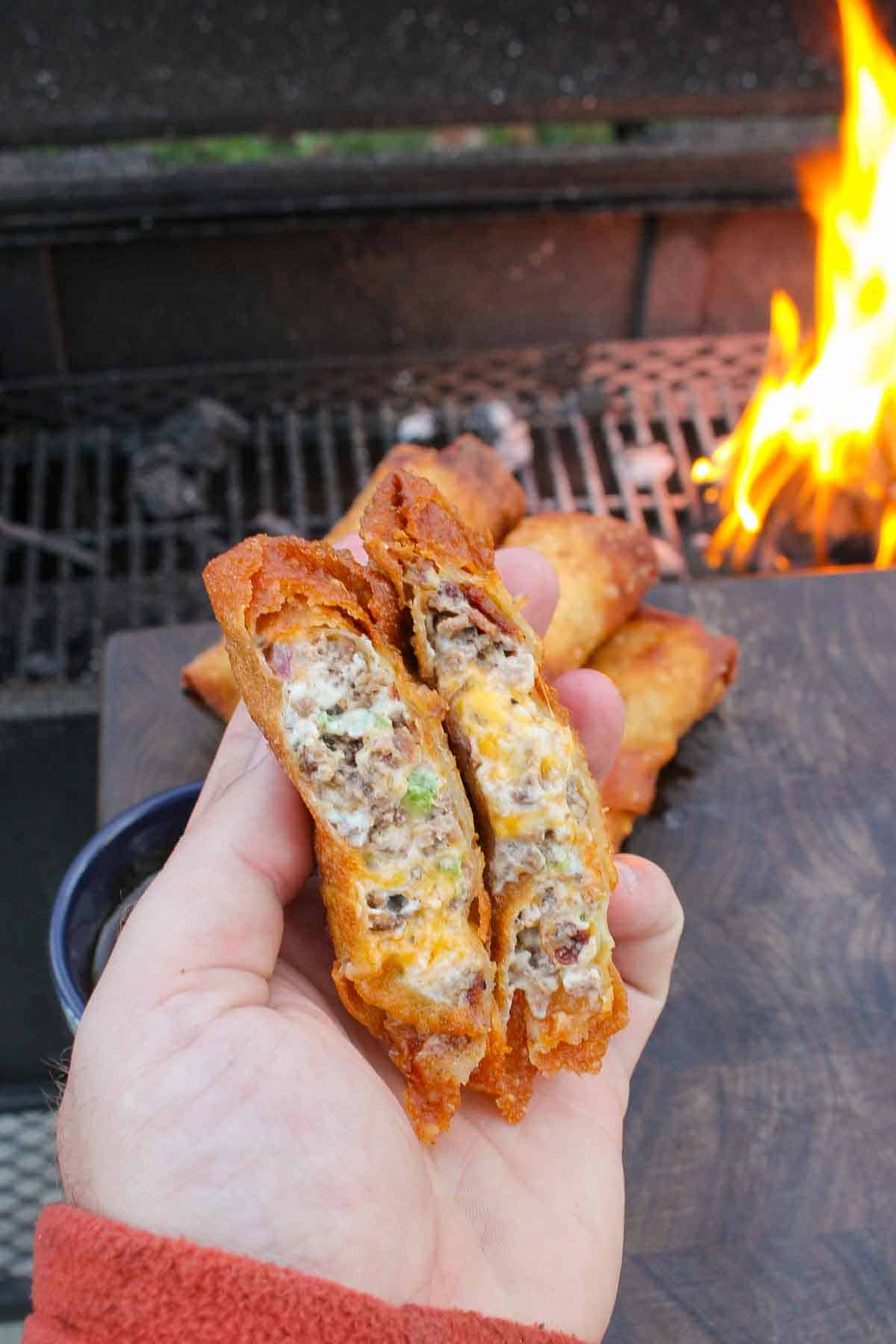 The jalapeno popper egg rolls are sliced and ready to devour.