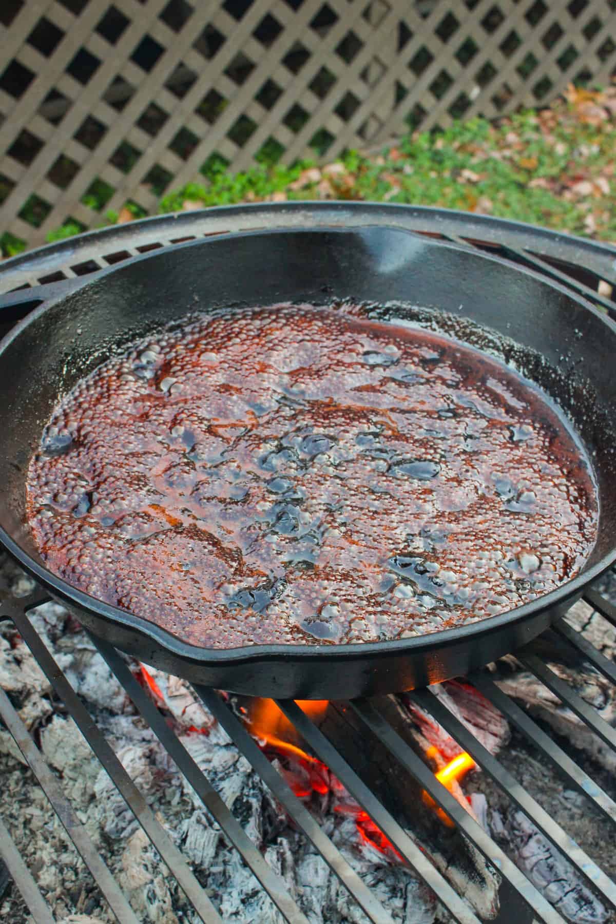 Boiling some wine in the pan to deglaze it.