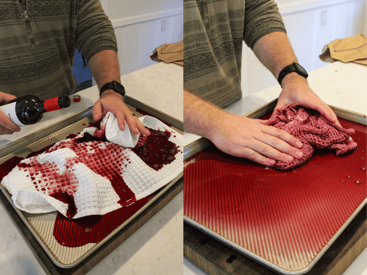 Red wine is poured over the cotton dish towel to add moisture and flavor to the meat while cooking over the coals. 