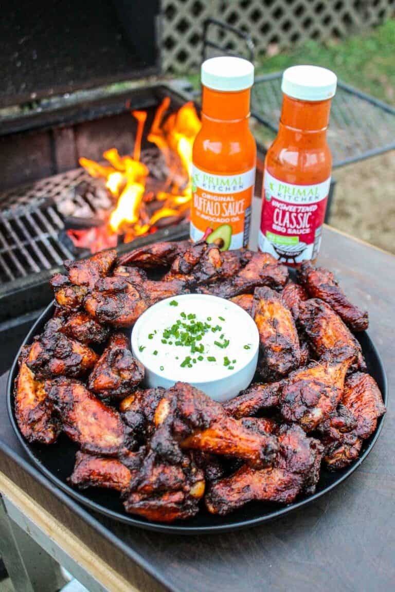 Smoked and twice fried chicken wings seasoned with Primal Kitchen BBQ Sauce and Buffalo Sauce is foodie heaven.