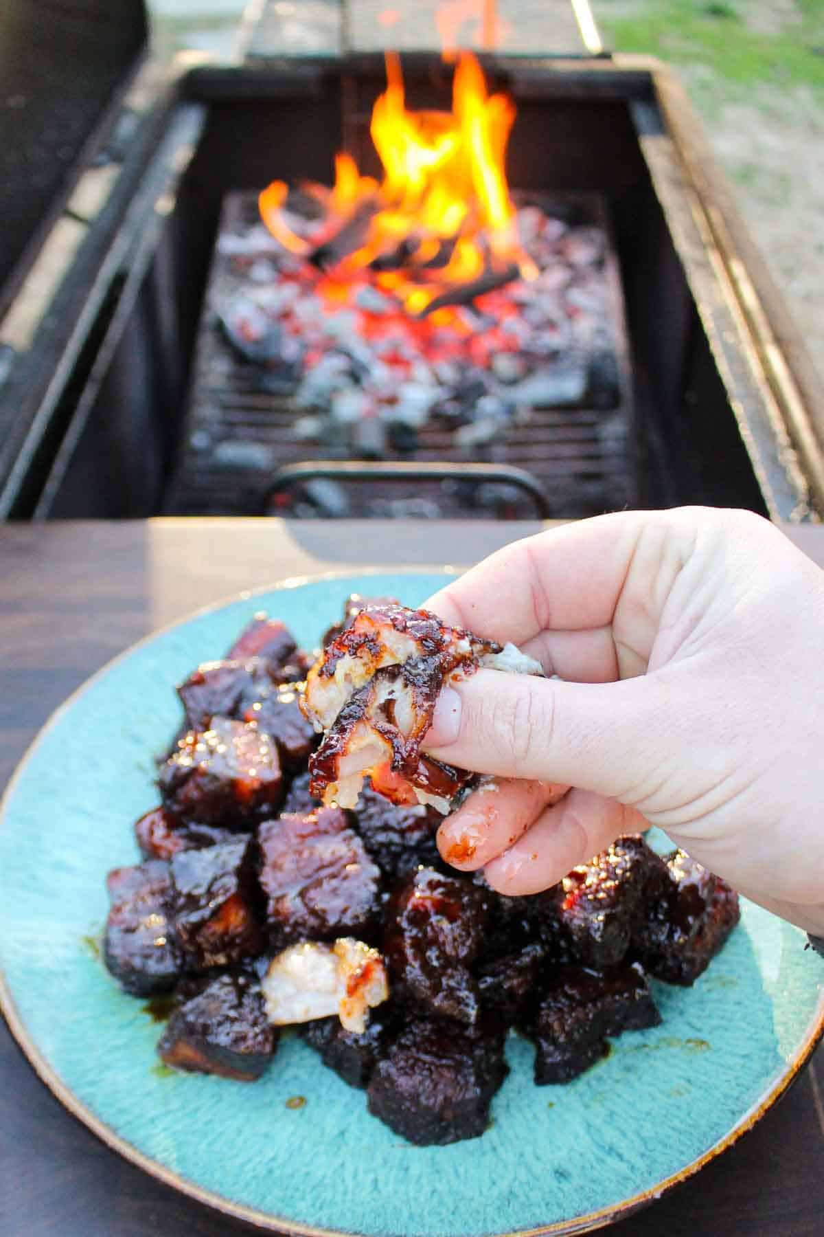 Derek Wolf gets ready for a bite of Smoked Pork Burnt Ends. 