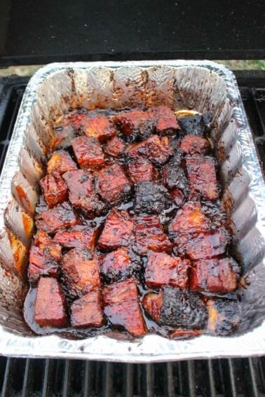 BBQ Burnt Ends in a foil container.