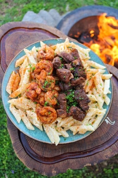 Cajun steak and shrimp alfredo, served and ready to eat.