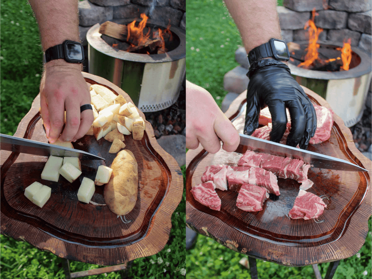 The potatoes are cubed on the cutting board, and the ribeyes are sliced into cubes. 